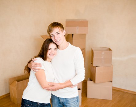 Office furniture and packed boxes prepared for commercial relocation