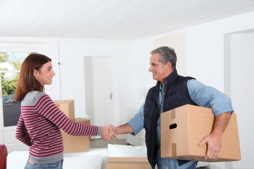 Professional moving crew handling household items in Maida Vale