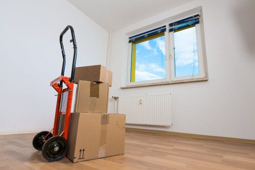 Local movers organising labelled boxes for a move in Maida Vale