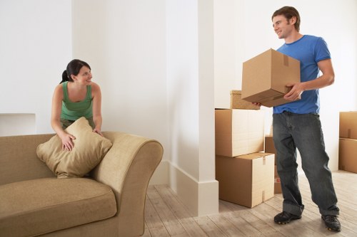 Boxes and furniture being loaded into a moving van